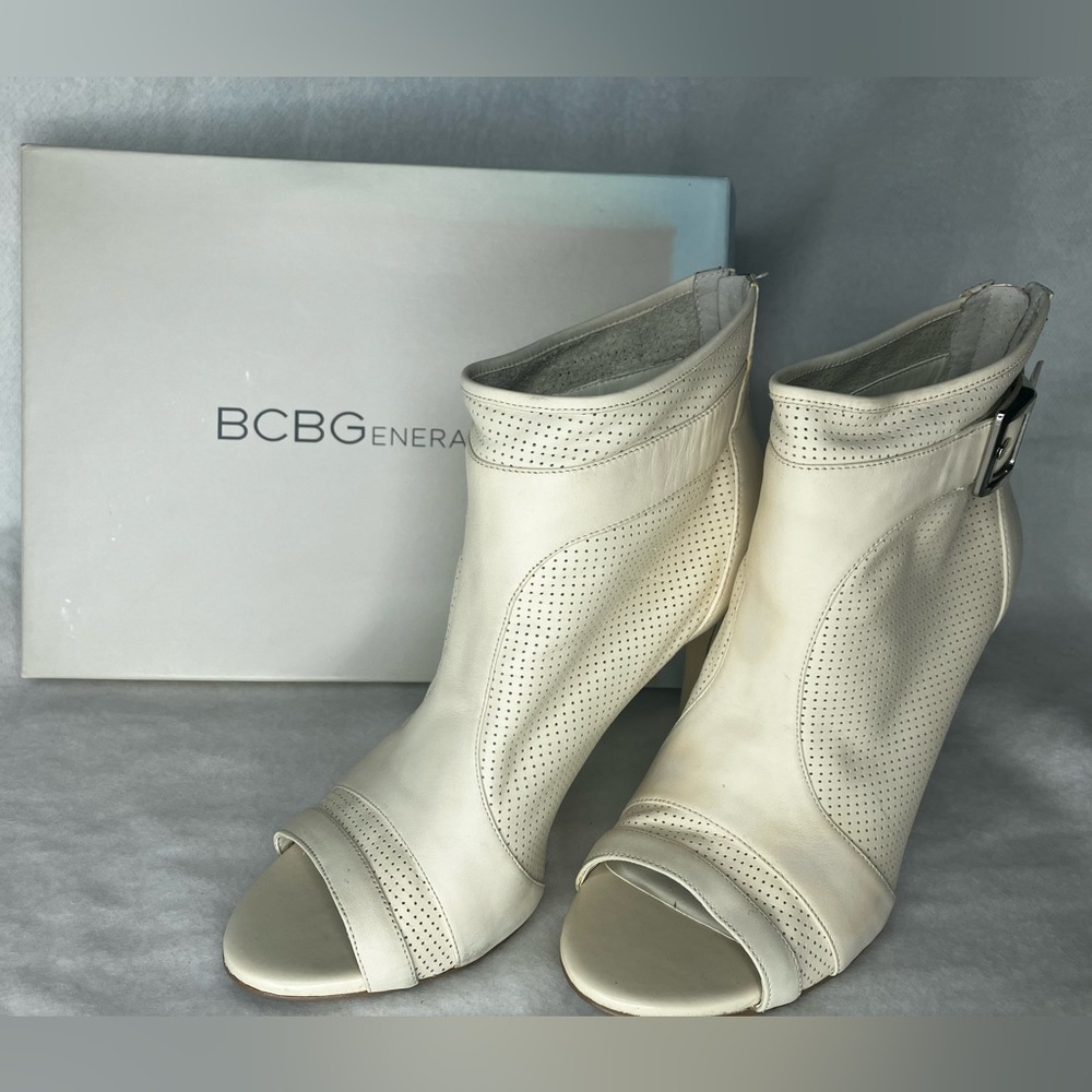 BCBG, cream colored open toed booties with stiletto heel. Women’s size 10.